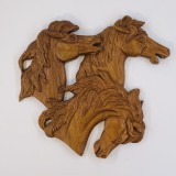 Horses in pierced relief